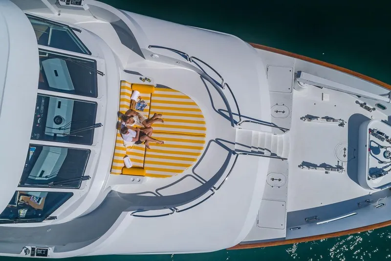 Slide: The Image of Aerial view of 2002 Christensen Tri Deck yacht with sunbathers on striped lounge. - 5
