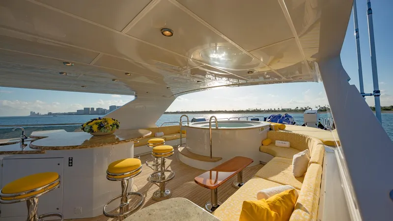 Slide: The Image of Luxurious 2002 Christensen Tri Deck yacht with elegant seating and ocean view. - 8