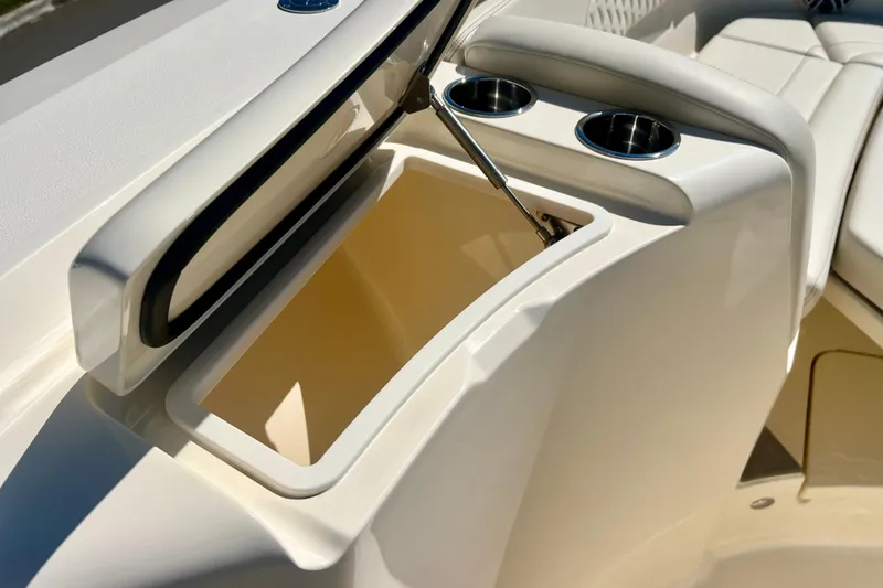 Slide: The Image of 2026 Scout 357 LXF boat interior with open storage compartments and engine access. - 30