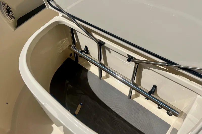 Slide: The Image of 2025 Scout 357 LXF boat anchor compartment open on deck. - 31