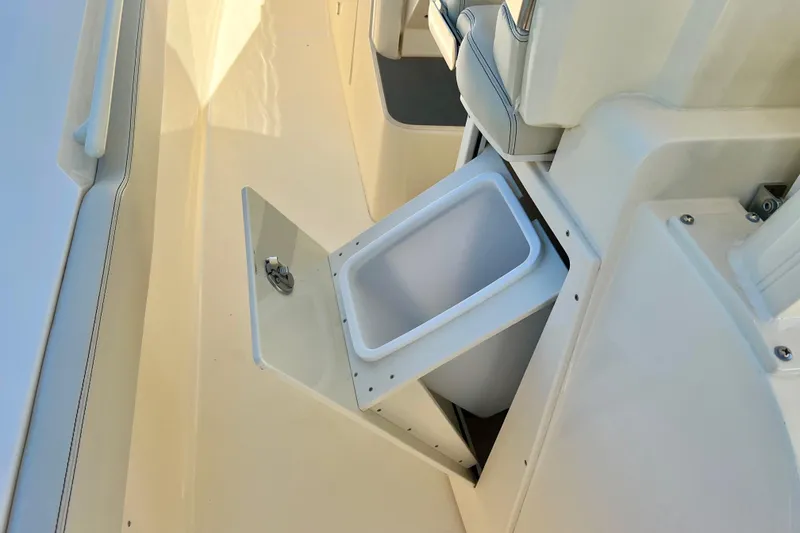 Slide: The Image of 2026 Scout 357 LXF boat with built-in storage compartment open. - 38