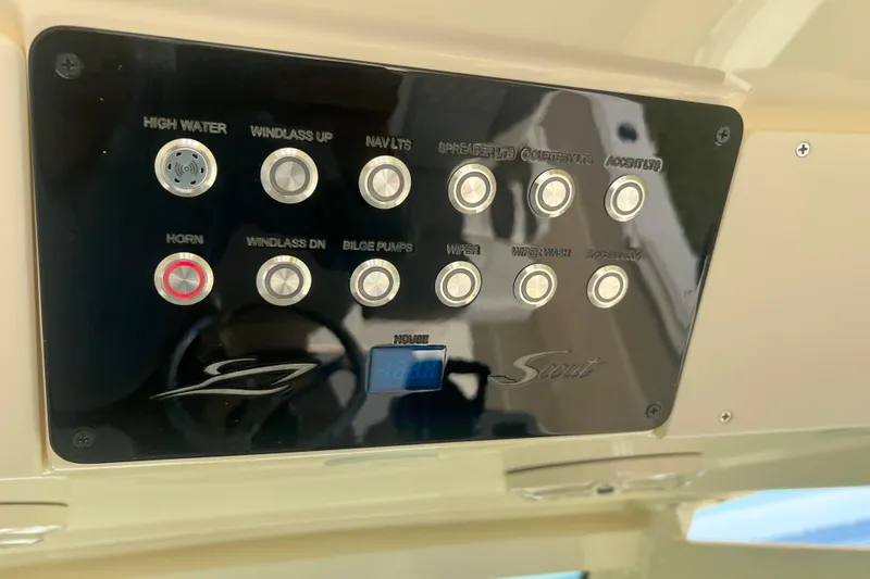 Slide: The Image of Control panel of 2026 Scout 357 LXF boat with labeled buttons and digital display. - 42