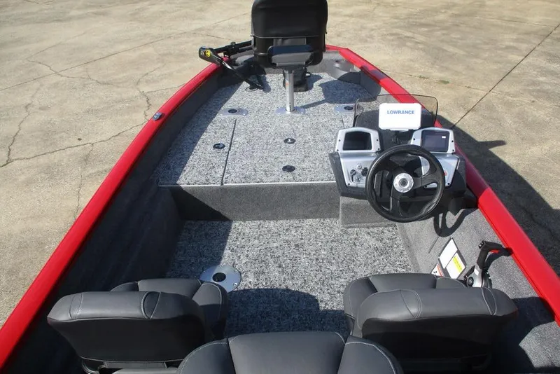 Slide: The Image of 2026 Tracker Pro Team 175 boat interior with steering console and seating. - 3