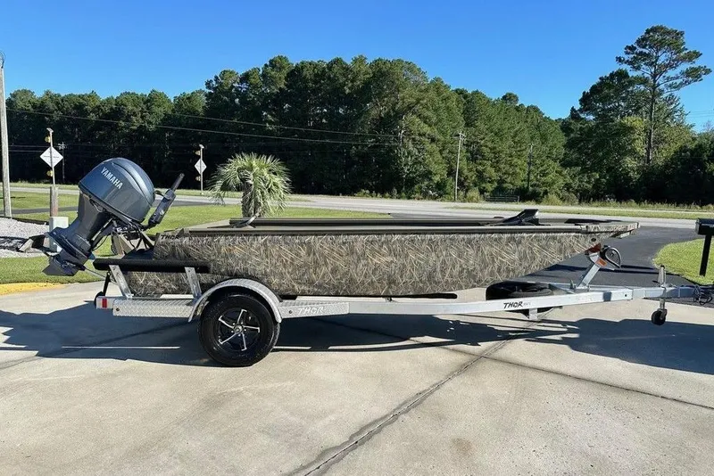 The Image of 2026 Thor 1754 Timber Hammer boat on trailer with Yamaha outboard motor. - 1