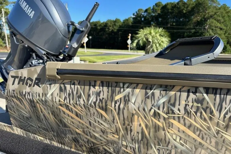 Slide: The Image of 2026 Thor 1754 Timber Hammer boat with camouflage design and Yamaha motor. - 6