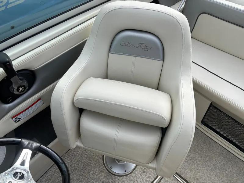 Slide: The Image of 2010 Sea Ray 210 SL SS boat seat, white leather, embroidered logo, luxury interior. - 5