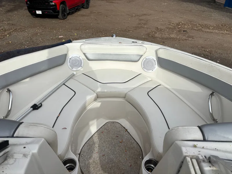 Slide: The Image of Interior of 2010 Sea Ray 210 SL SS boat with seating and speakers. - 8