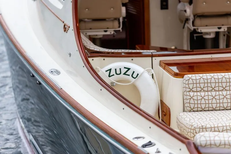 Slide: The Image of 2004 Hinckley Picnic Boat EP with elegant seating and life preserver. - 17