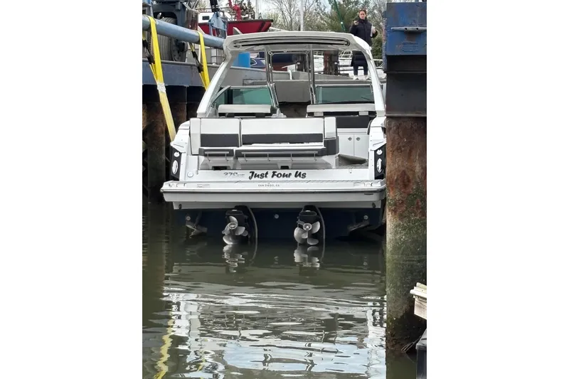 Slide: The Image of 2019 Monterey 378 Super Express boat docked, rear view with dual propellers. - 11