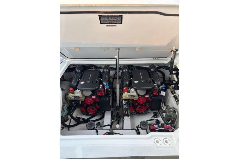 Slide: The Image of Engine compartment of a 2019 Monterey 378 Super Express boat, showcasing dual engines. - 12