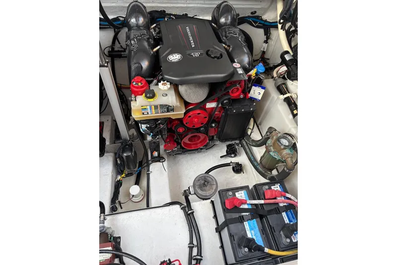 Slide: The Image of Engine compartment of a 2019 Monterey 378 Super Express boat, showcasing detailed components. - 13