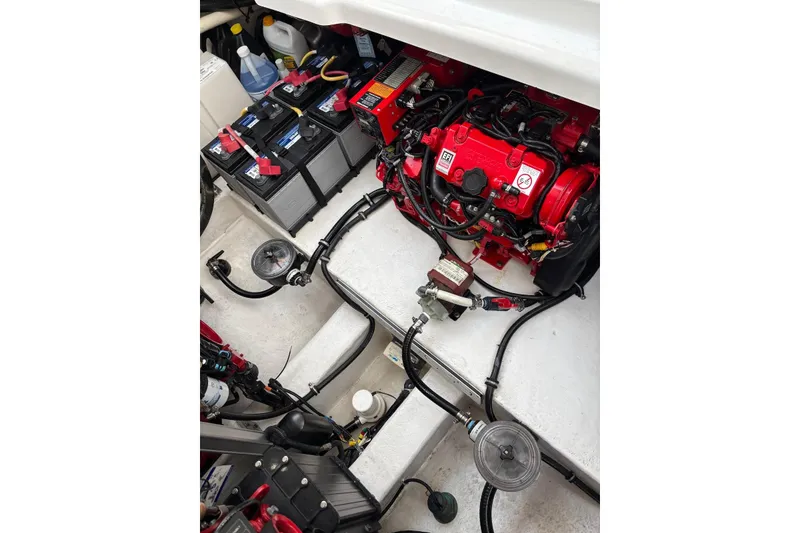 Slide: The Image of Engine compartment of a 2019 Monterey 378 Super Express boat with visible batteries and wiring. - 15