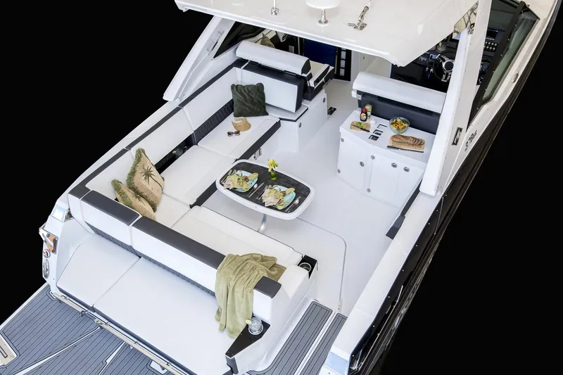 Slide: The Image of 2019 Monterey 378 Super Express boat docked by a bridge on a cloudy day. - 3