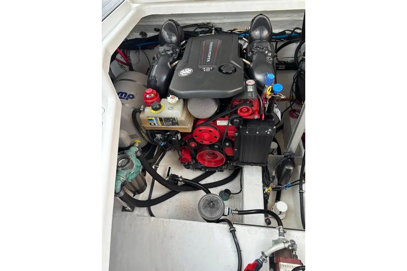 Slide: The Image of Engine compartment of a 2019 Monterey 378 Super Express boat, showcasing detailed components. - 14