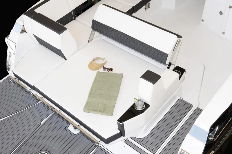 Slide: The Image of 2019 Monterey 378 Super Express cabin interior with striped bedding and modern wood finish. - 6