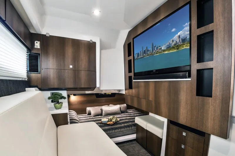 Slide: The Image of Interior of 2019 Monterey 378 Super Express with TV and modern wood cabinetry. - 7