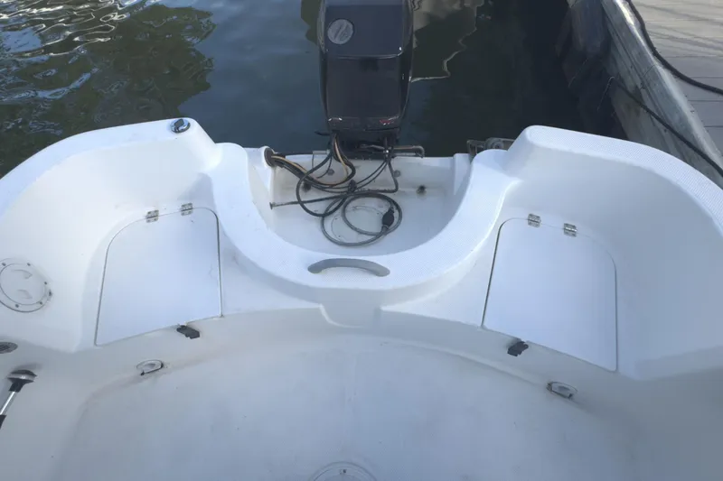 Slide: The Image of 2008 Trophy 1703 Center Console boat interior with motor and storage compartments. - 3