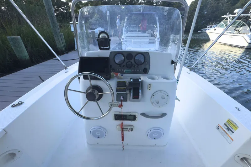 Slide: The Image of 2008 Trophy 1703 Center Console boat interior with white seating and deck details. - 6