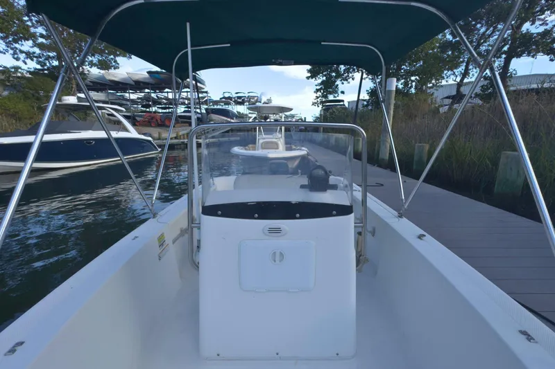 Slide: The Image of 2008 Trophy 1703 Center Console boat docked at marina with canopy. - 9