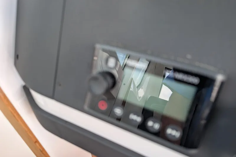 Slide: The Image of Close-up of a control panel in a 2019 Axopar 28 CABIN boat. - 38