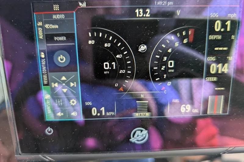 Slide: The Image of Axopar 28 CABIN 2019 dashboard display showing speed, fuel, and vessel controls. - 29