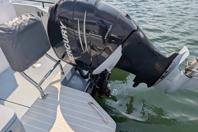 Slide: The Image of 2019 Axopar 28 CABIN with Mercury Verado outboard engine on water. - 55