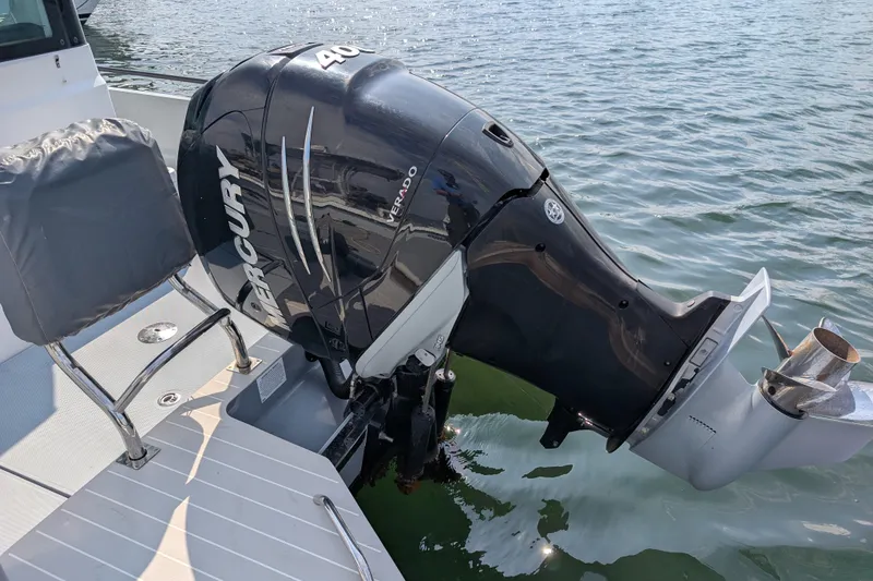 Slide: The Image of 2019 Axopar 28 CABIN with Mercury Verado 400 outboard engine on water. - 13