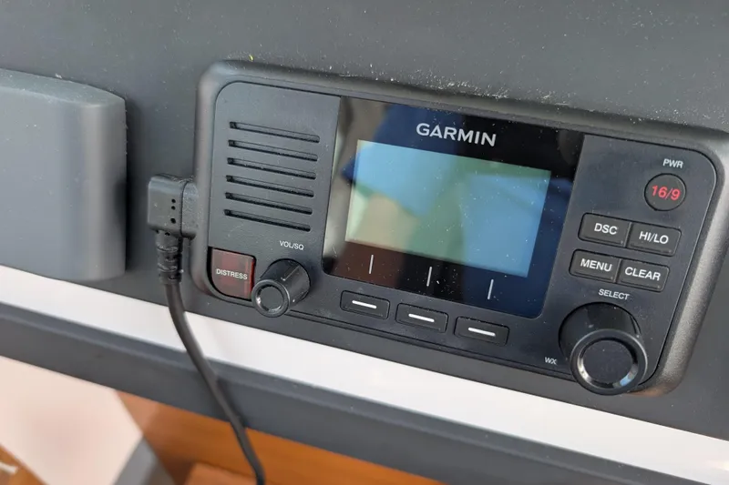 Slide: The Image of Garmin marine radio on 2019 Axopar 28 CABIN boat dashboard. - 37