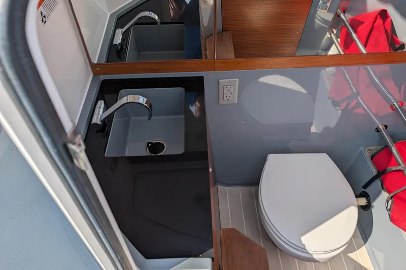 Slide: The Image of Compact bathroom in 2019 Axopar 28 CABIN with sink and toilet. - 42