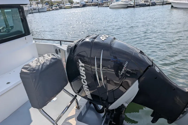 Slide: The Image of 2019 Axopar 28 CABIN with Mercury Verado 400 outboard engine at marina. - 54