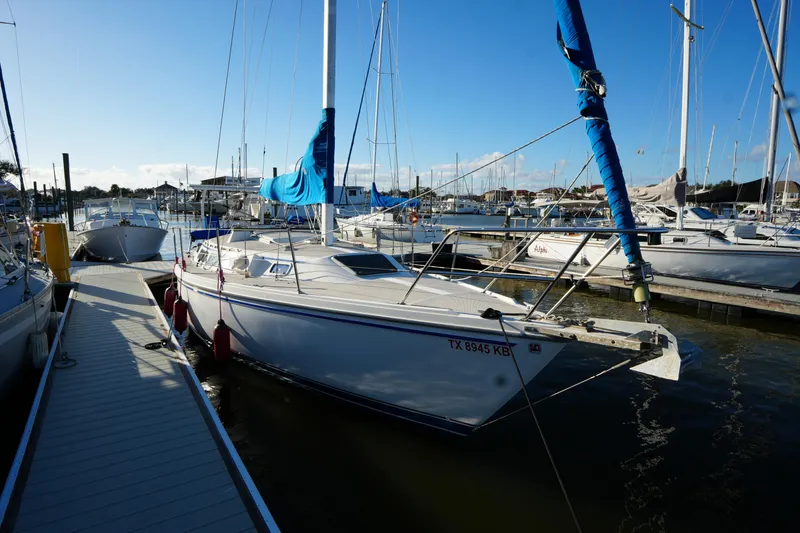 Slide: The Image of 1989 Catalina 30 Tall Rig Mark II docked at marina. - 3
