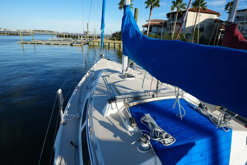 Slide: The Image of 1989 Catalina 30 Tall Rig Mark II sailboat at dock. - 5