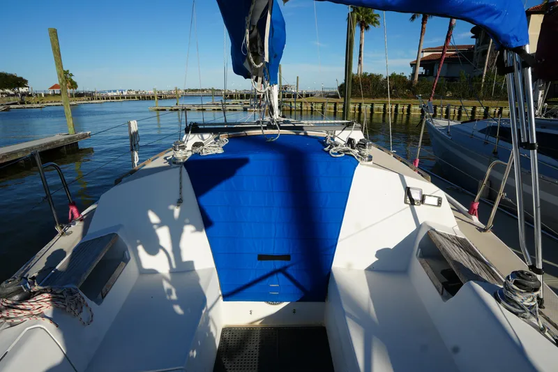 Slide: The Image of 1989 Catalina 30 Tall Rig Mark II sailboat docked in harbor. - 8