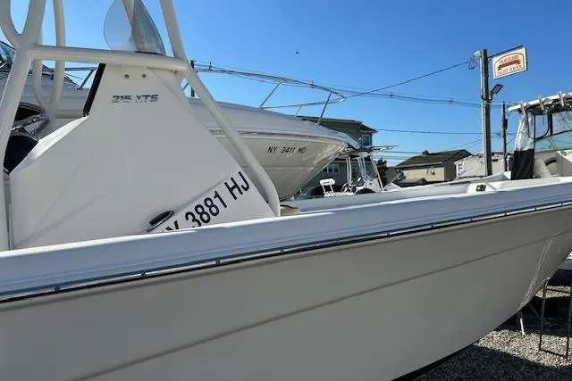 Slide: The Image of 2023 Nautistar 227XTS boat displayed outdoors on a sunny day. - 10