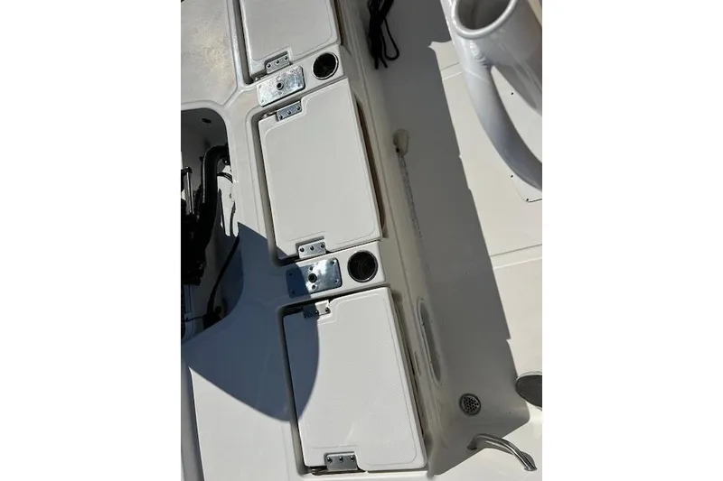 Slide: The Image of 2023 Nautistar 227XTS boat deck with storage compartments and fixtures. - 9