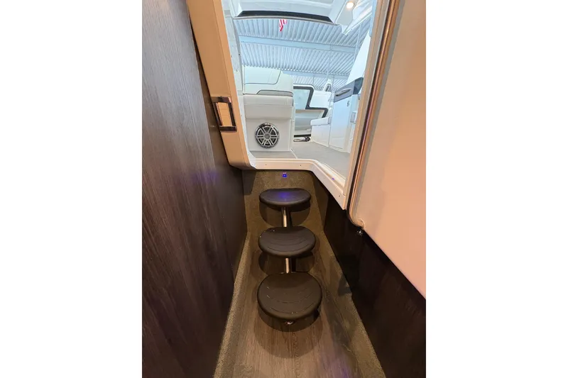 Slide: The Image of 2021 Formula 330 Crossover Bowrider I/O cabin interior with modern seating and lighting. - 30