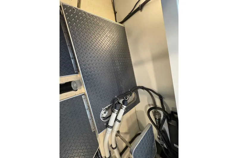 Slide: The Image of Engine compartment of 2021 Formula 330 Crossover Bowrider I/O with visible components and wiring. - 42