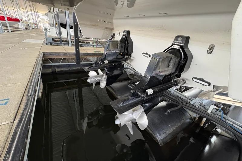 Slide: The Image of Open storage compartment in 2021 Formula 330 Crossover Bowrider I/O boat interior. - 47