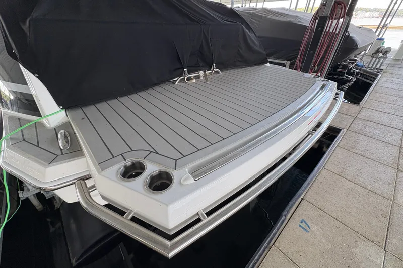 Slide: The Image of 2021 Formula 330 Crossover Bowrider I/O docked in a covered marina. - 7