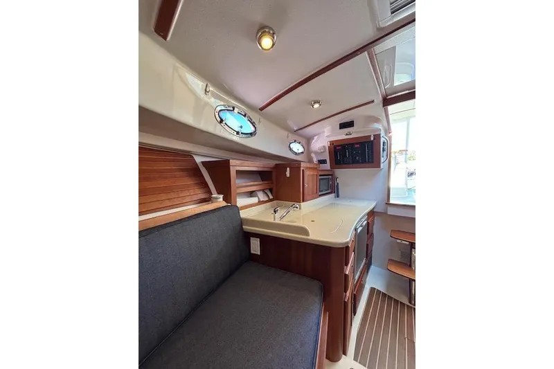 Slide: The Image of Interior of 2018 Back Cove 30 boat with modern kitchen and seating area. - 24