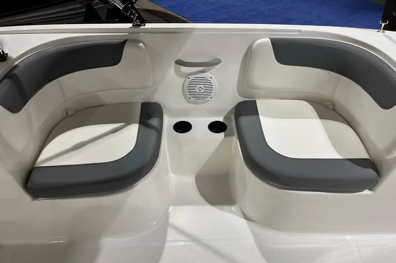 Slide: The Image of 2026 Bayliner Element E18 boat interior with cushioned seating and speaker. - 10
