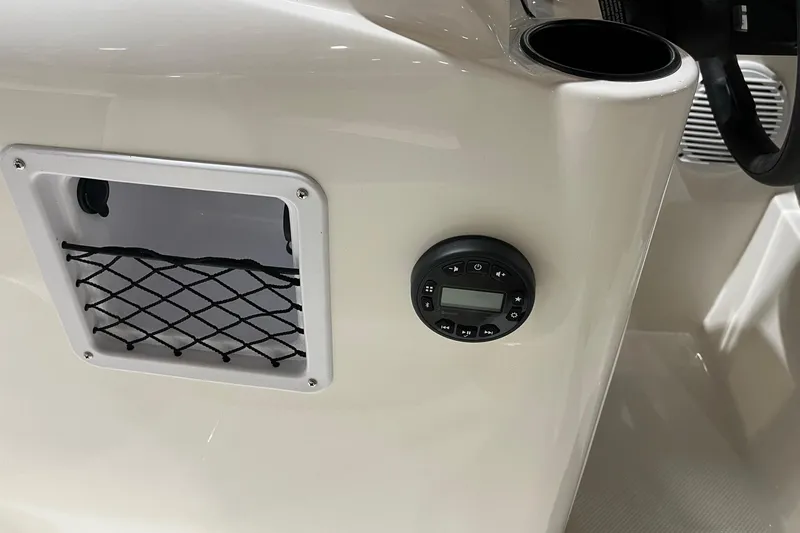 Slide: The Image of 2026 Bayliner Element E18 dashboard with control panel and storage net. - 12