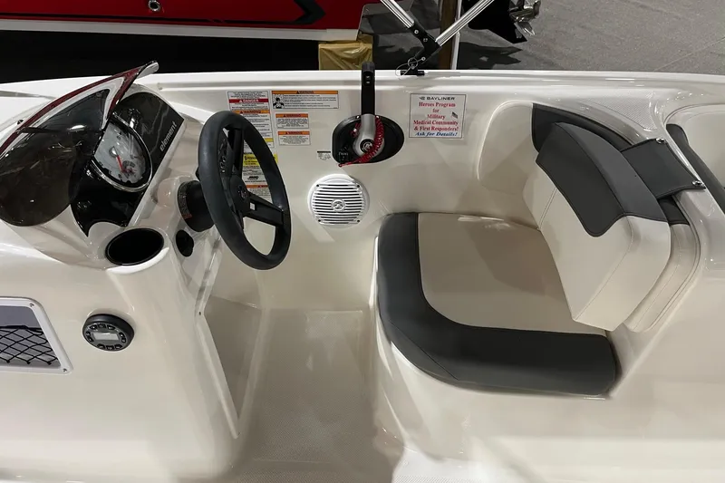 Slide: The Image of 2026 Bayliner Element E18 boat interior with steering wheel and seating. - 8