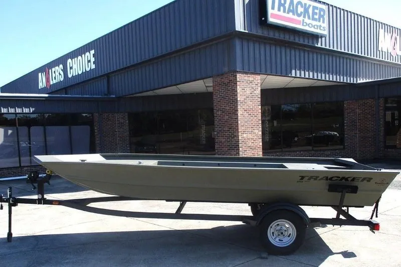 The Image of 2026 Tracker Grizzly 1754 Utility boat on trailer outside dealership. - 1