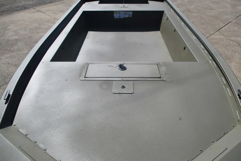 Slide: The Image of 2026 Tracker Grizzly 1754 Utility boat interior with storage compartment. - 3