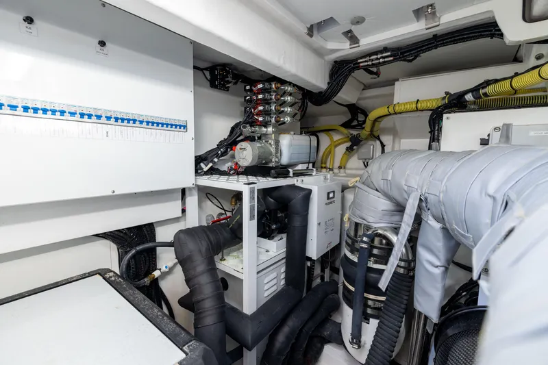 Slide: The Image of Engine room of 2025 Fairline Squadron 58 yacht, showcasing advanced mechanical systems. - 103