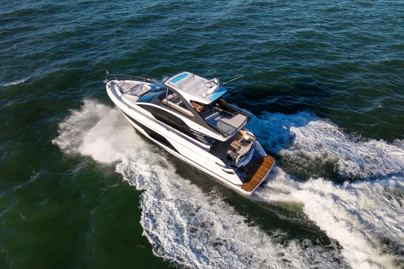 Slide: The Image of 2025 Fairline Squadron 58 yacht cruising on open water. - 108