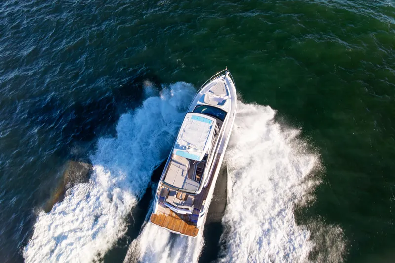 Slide: The Image of Aerial view of 2025 Fairline Squadron 58 yacht cruising on open water. - 109