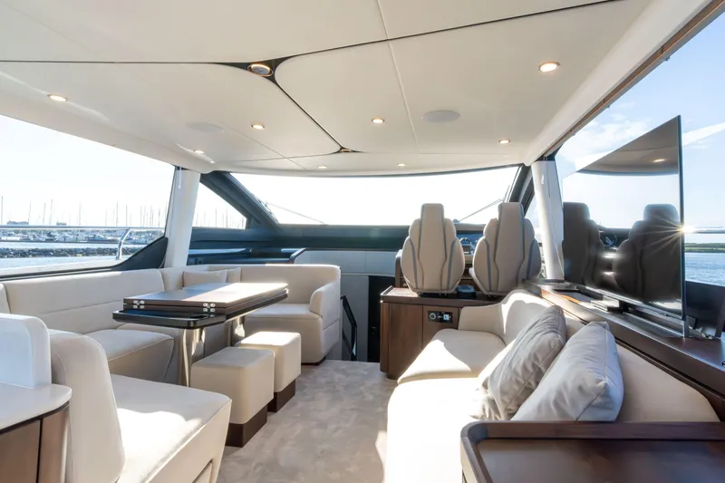 Slide: The Image of Luxury Fairline Squadron 58 yacht deck with seating and bar, 2025 model. - 12