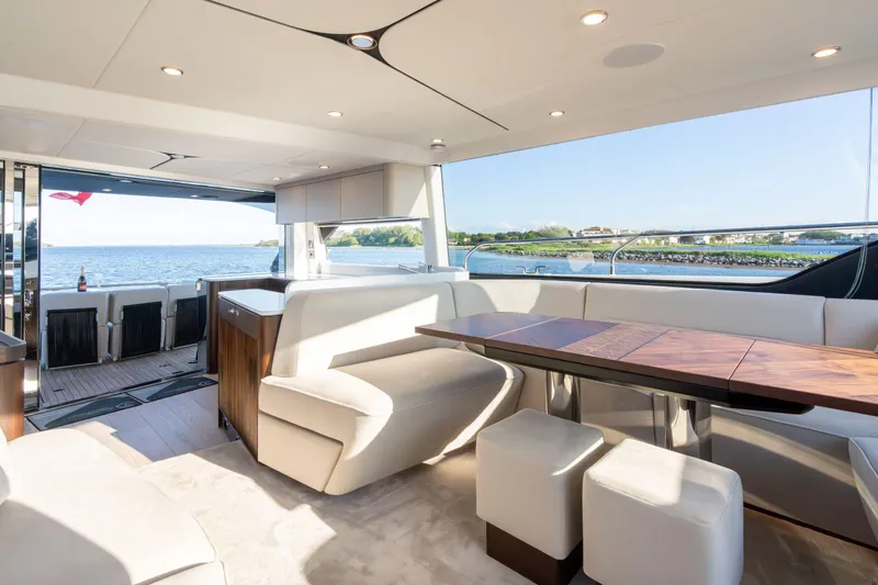 Slide: The Image of Luxury deck of 2025 Fairline Squadron 58 yacht with scenic water view. - 15